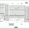 גדר פלדה גבוהה בין עמודים בחיפוי בזלת
